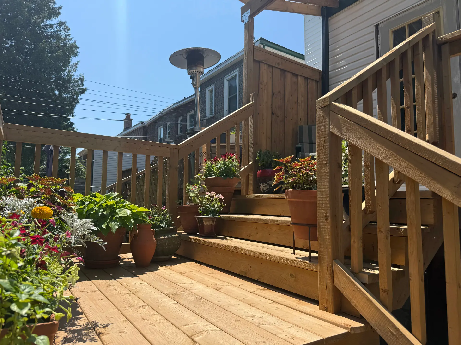Cedar deck with planters and wide stairs | Davisville Village