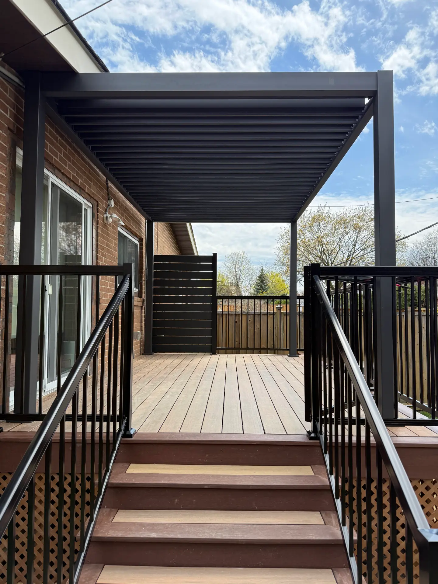 Composite deck with louvered pergola and aluminum railing | Lawrence Park